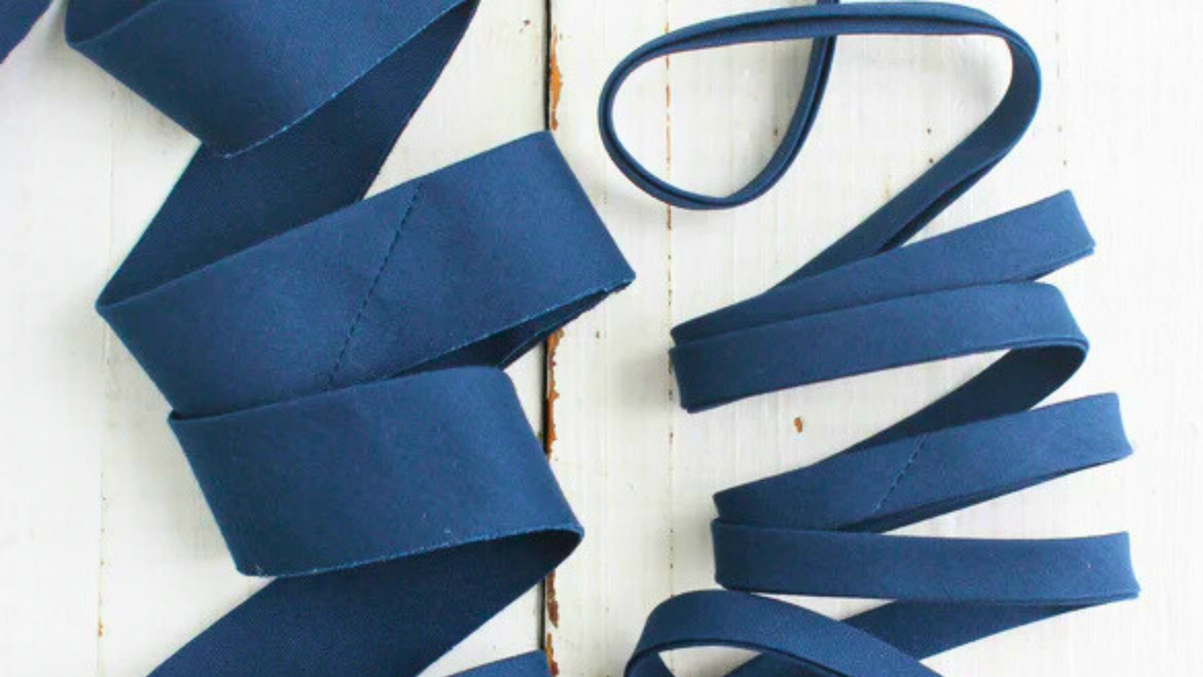 Bias Tape sold by Sew to Speak craft store is the secret weapon for creating clean, polished edges.